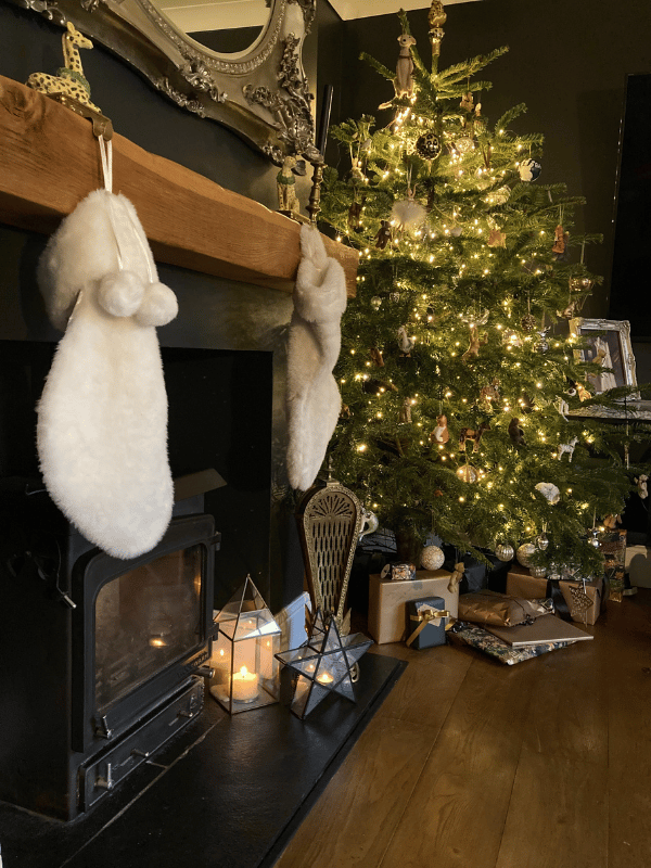 Cosy christmas decor by fireplace