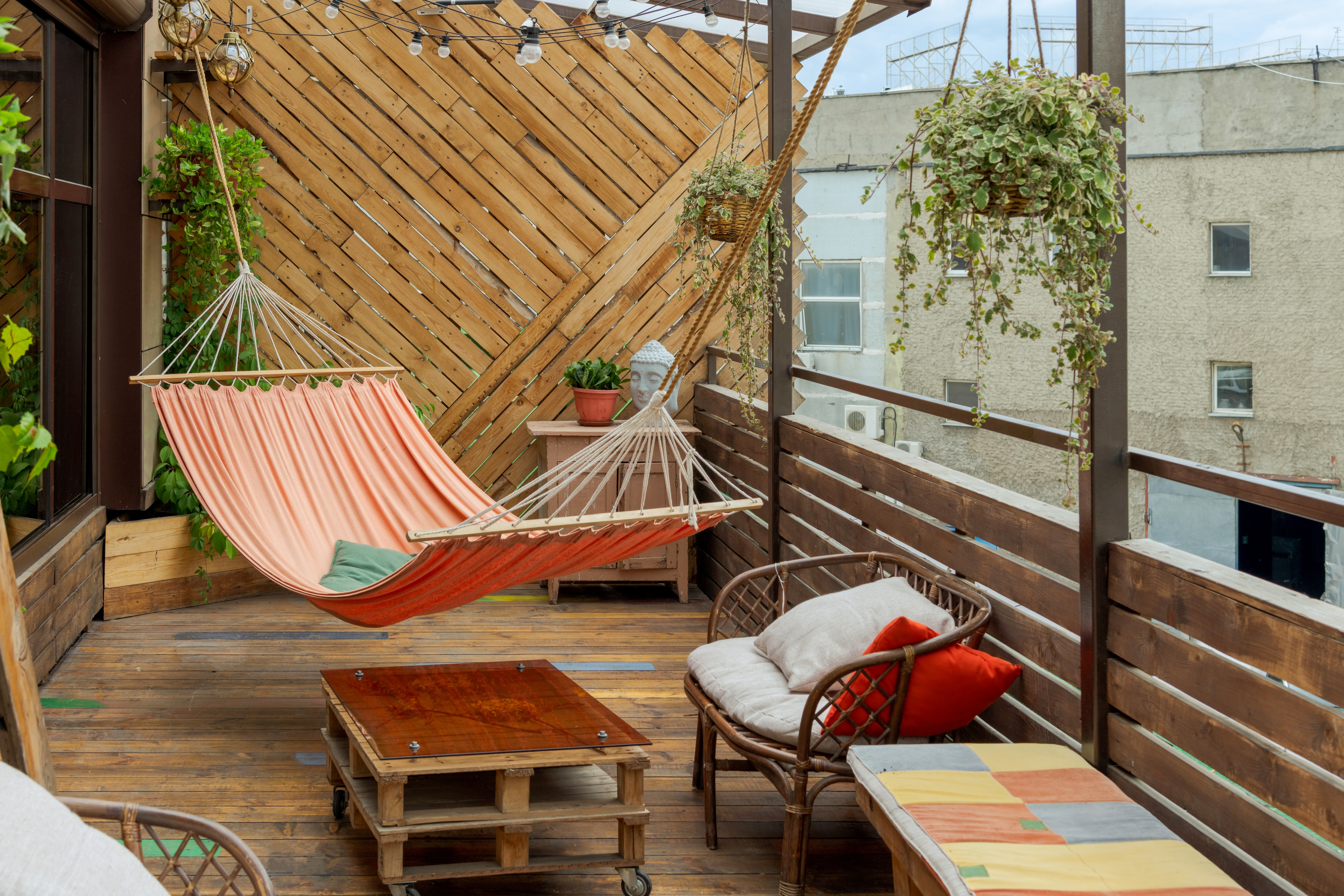 Wooden balcony with red hammock