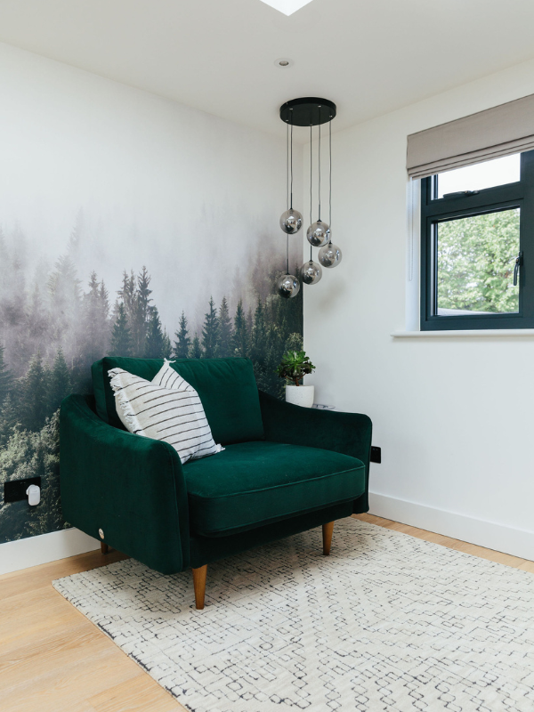 Wall mural with green chair 