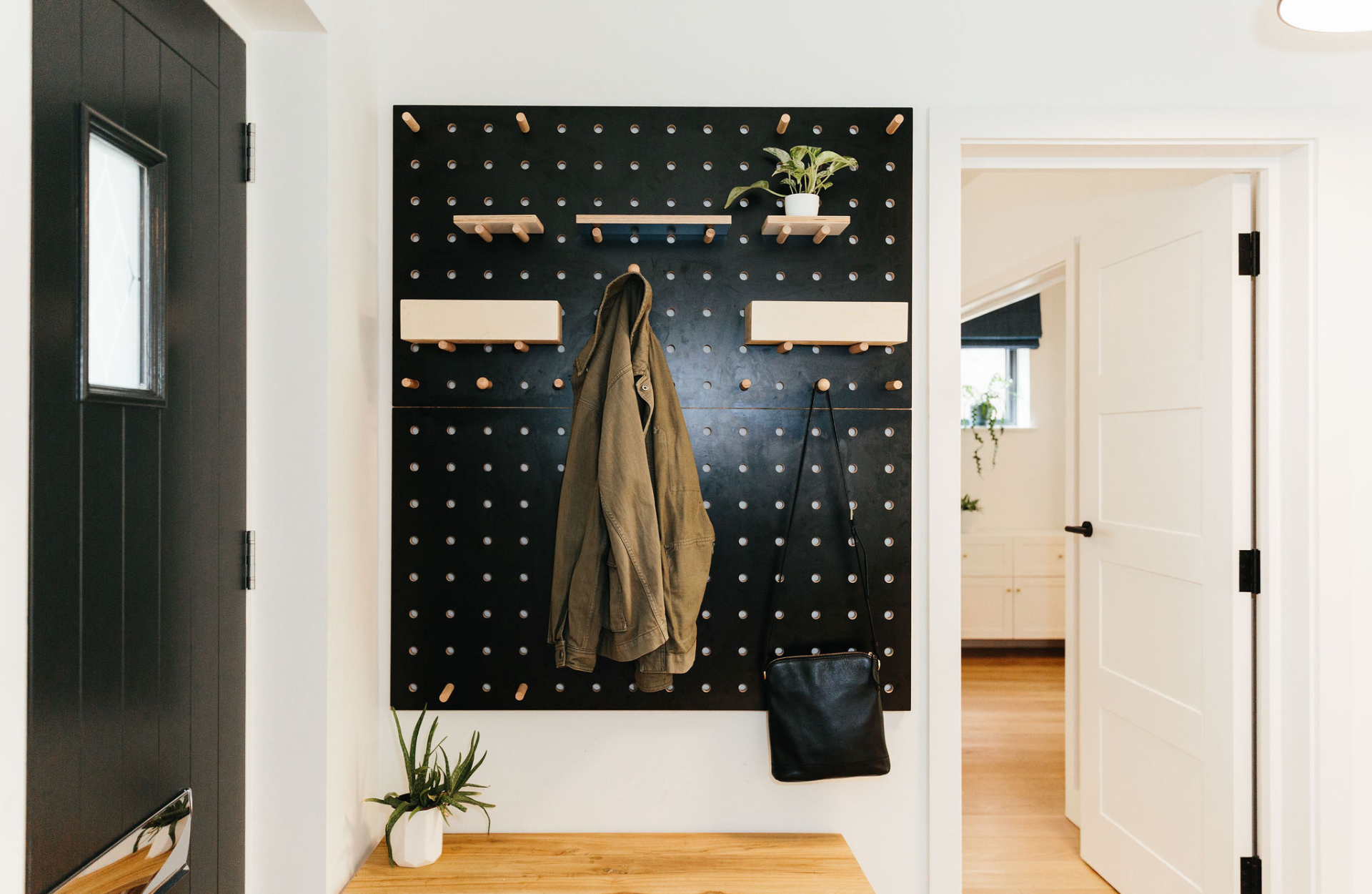 hallway with dual purpose hangers and shelves