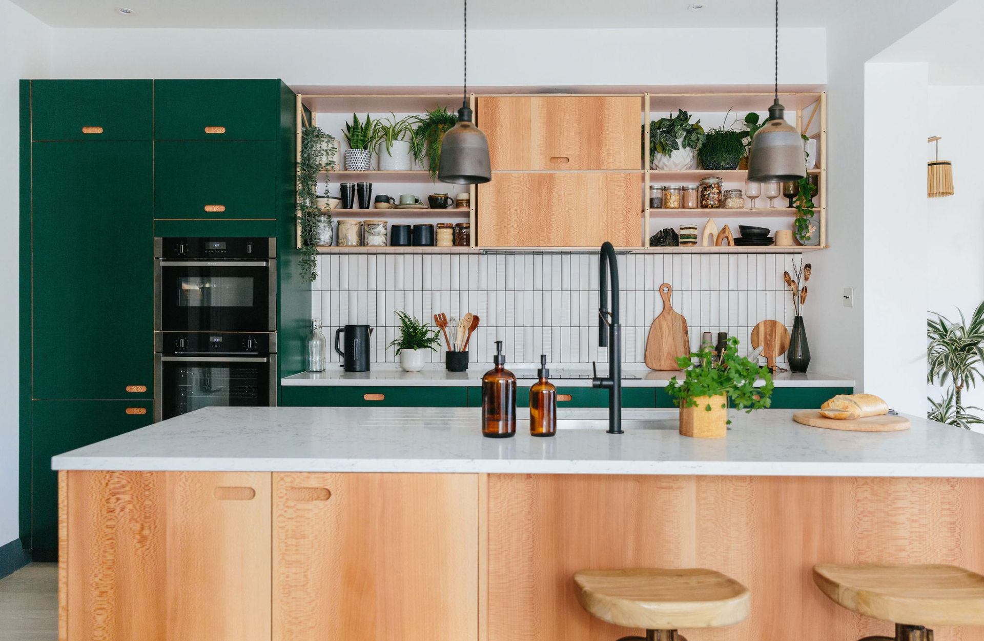 Green and wooden kitchen with marble worktops