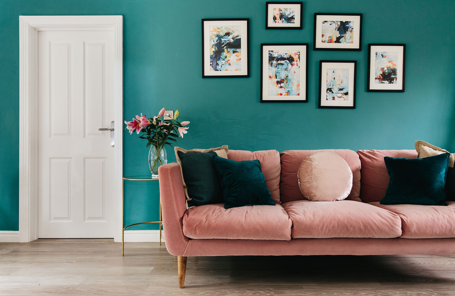 Pink sofa blue cushions