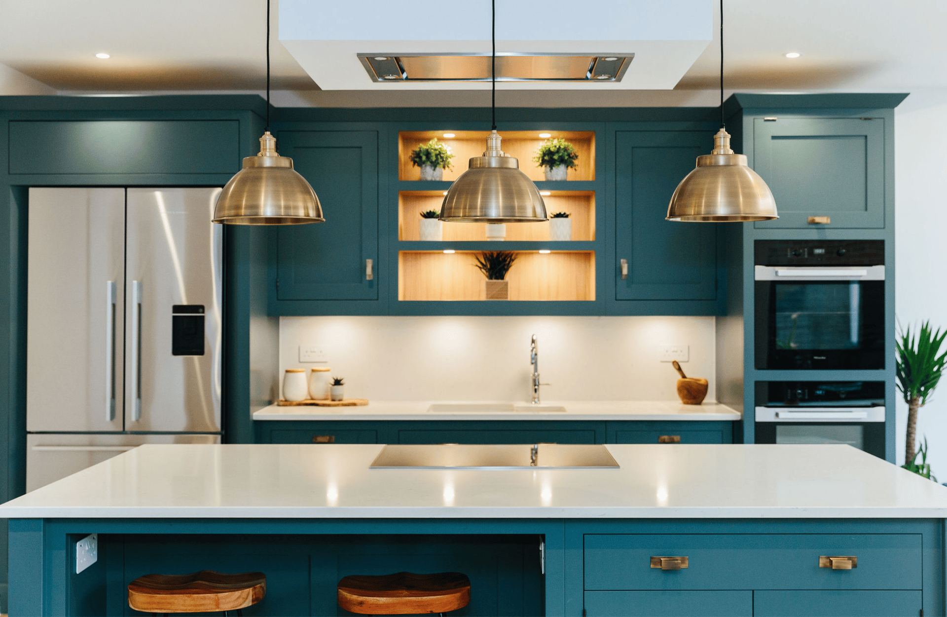 blue and white kitchen with brass accents