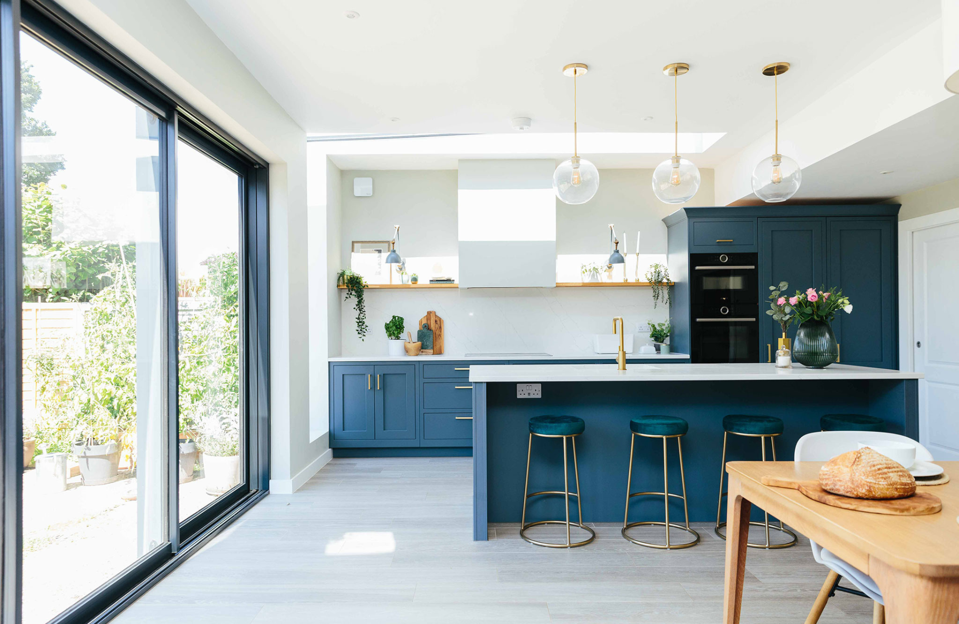 Blue kitchen with bifold doors