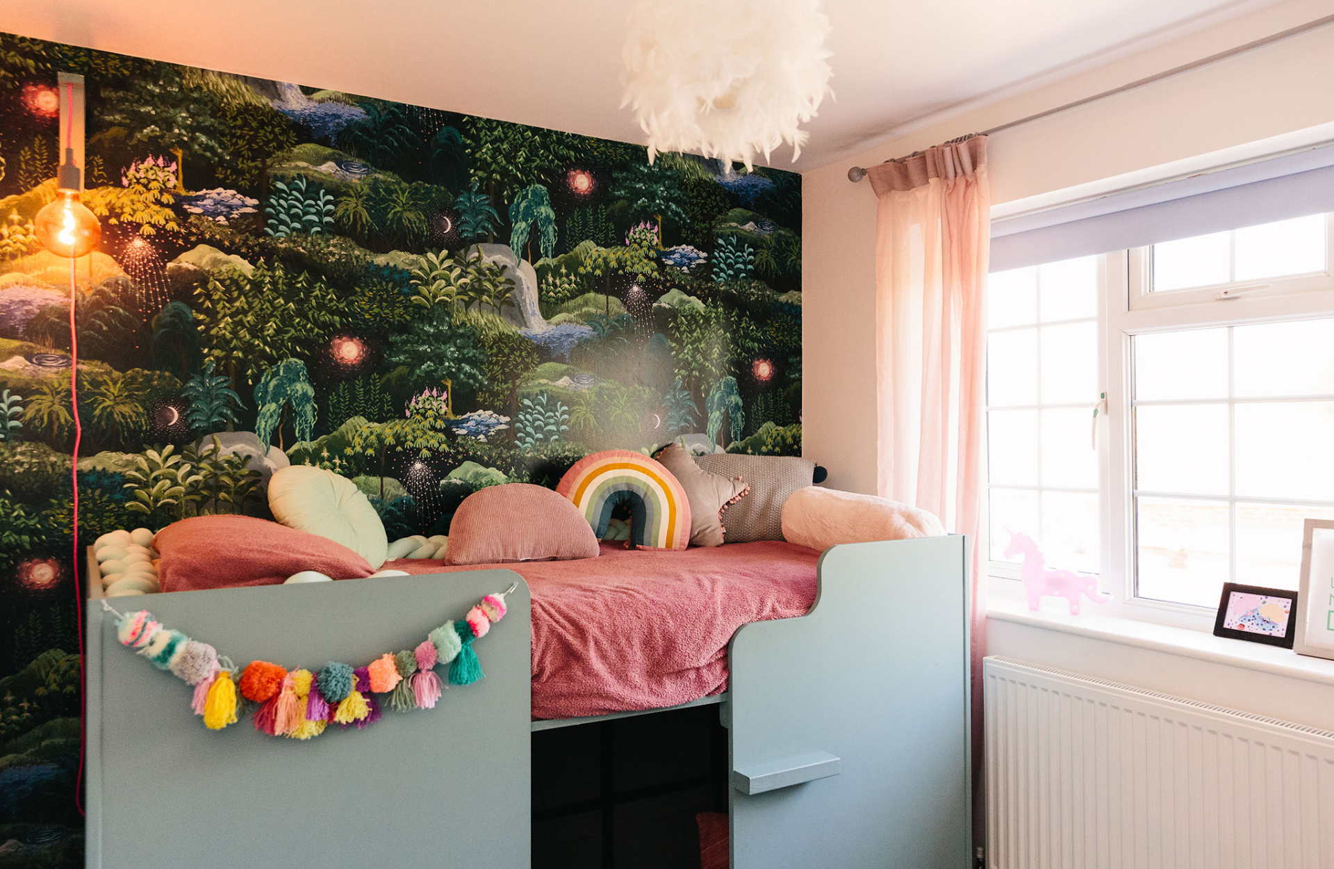 Child's bedroom with jungle wall feature