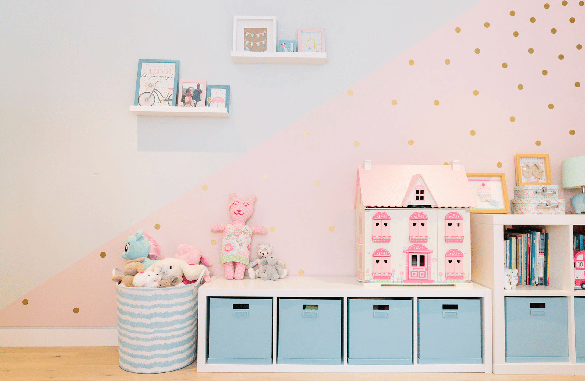 Kids bedroom wall with half blue half pink and gold dots