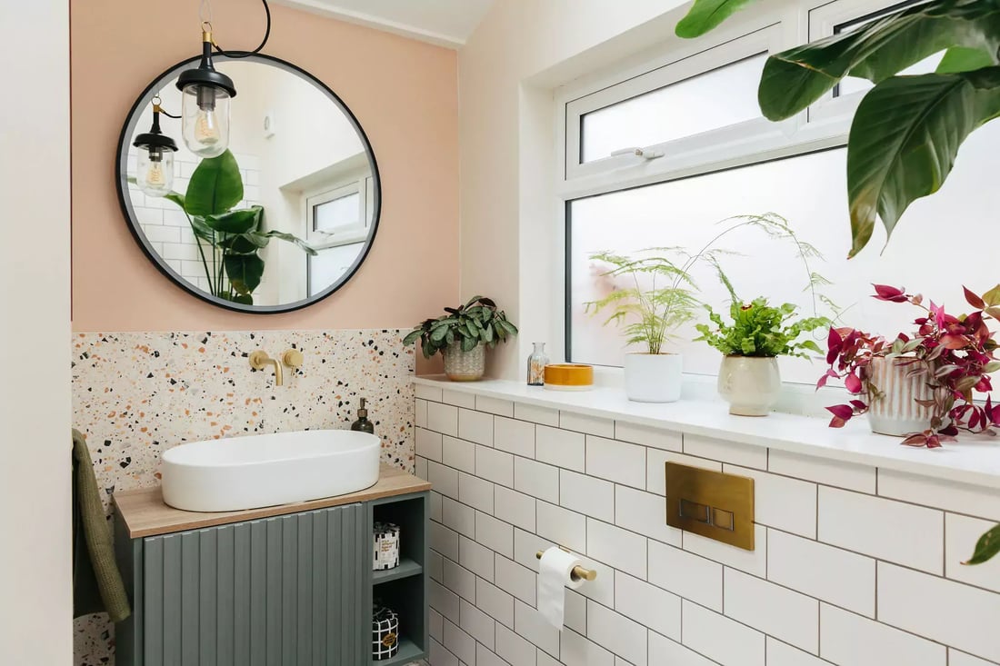 Pink and terrazzo tiled bathroom