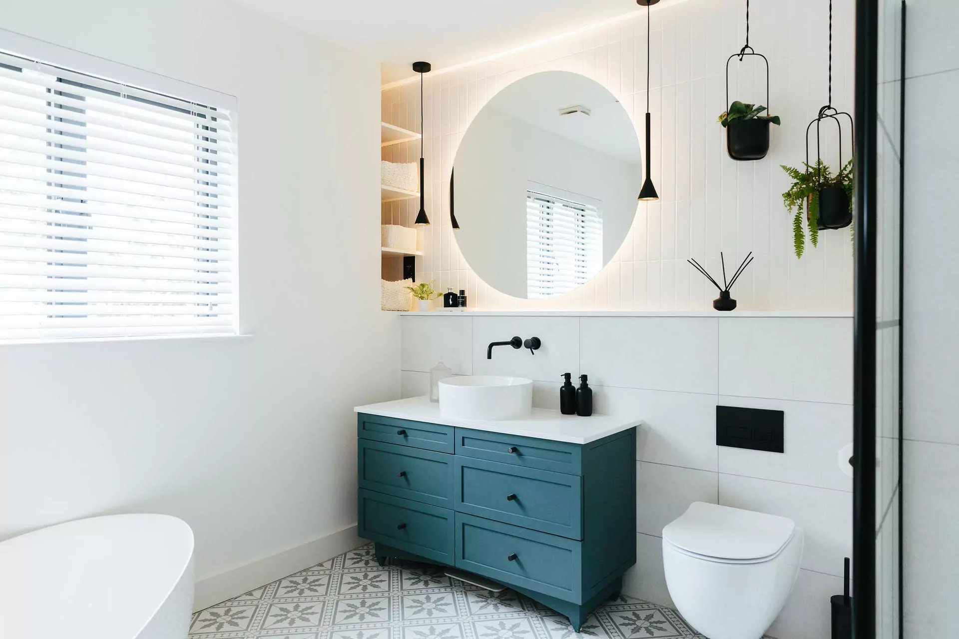 large, bright bathroom with black and blue accents