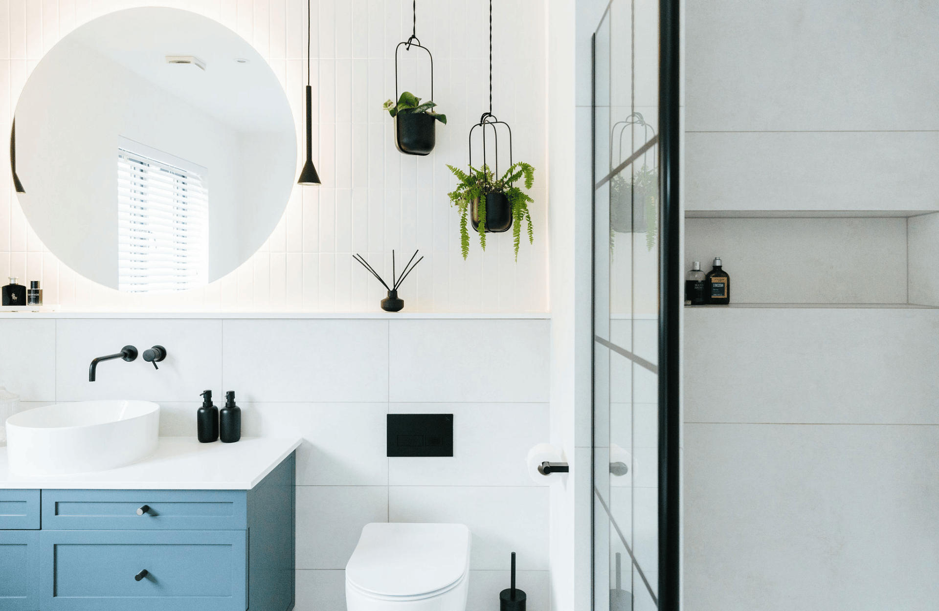 Bright white bathroom with blue and black details