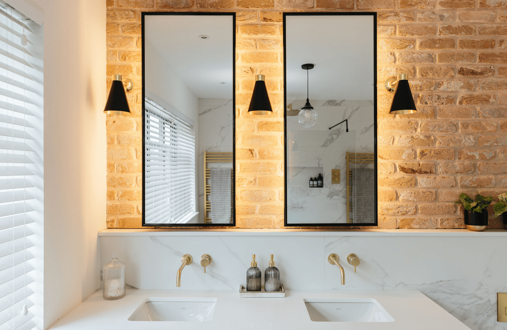 Bathroom with exposed brick wall