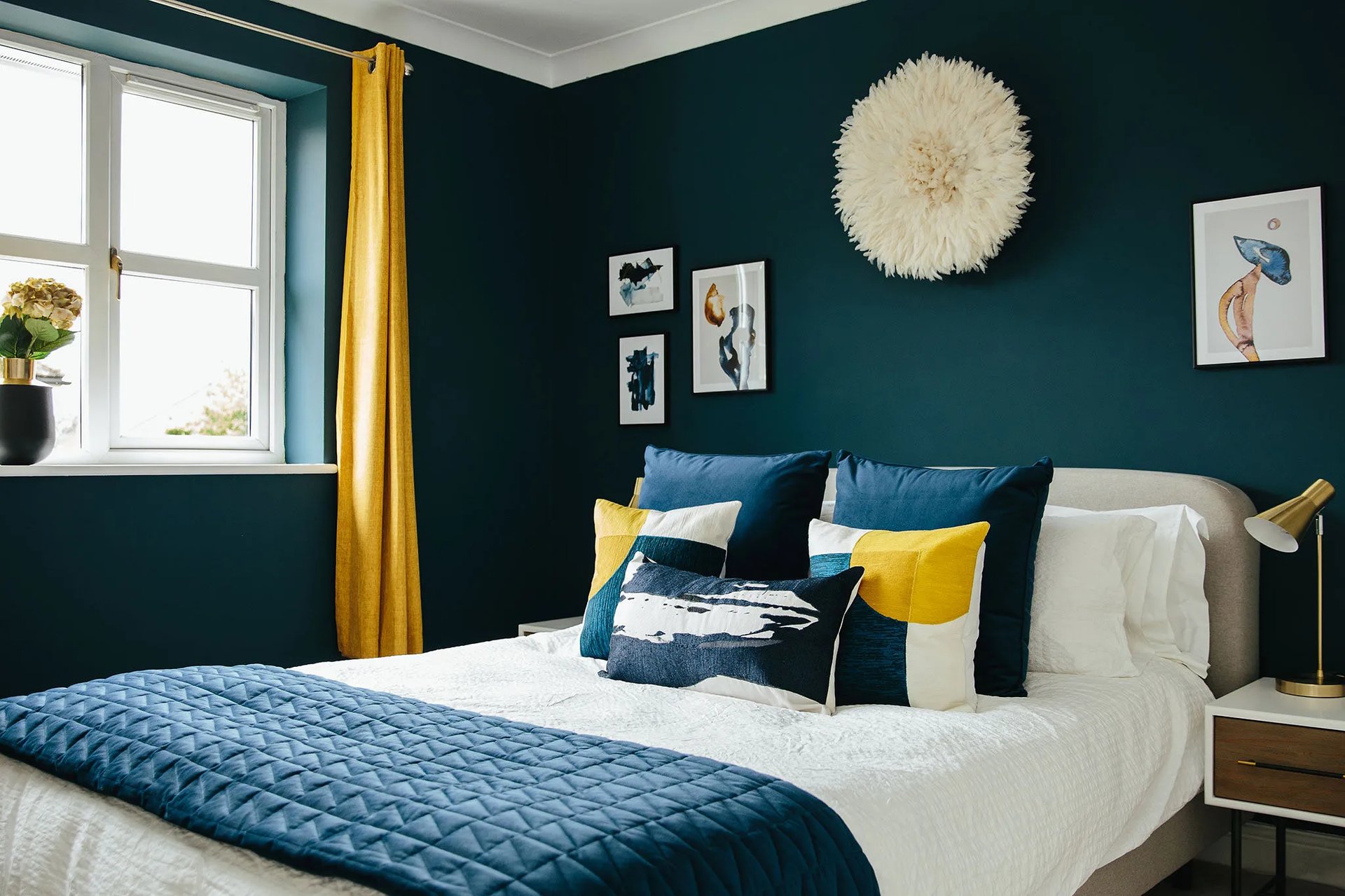 Bright and bold bedroom with pops of cheerful yellow