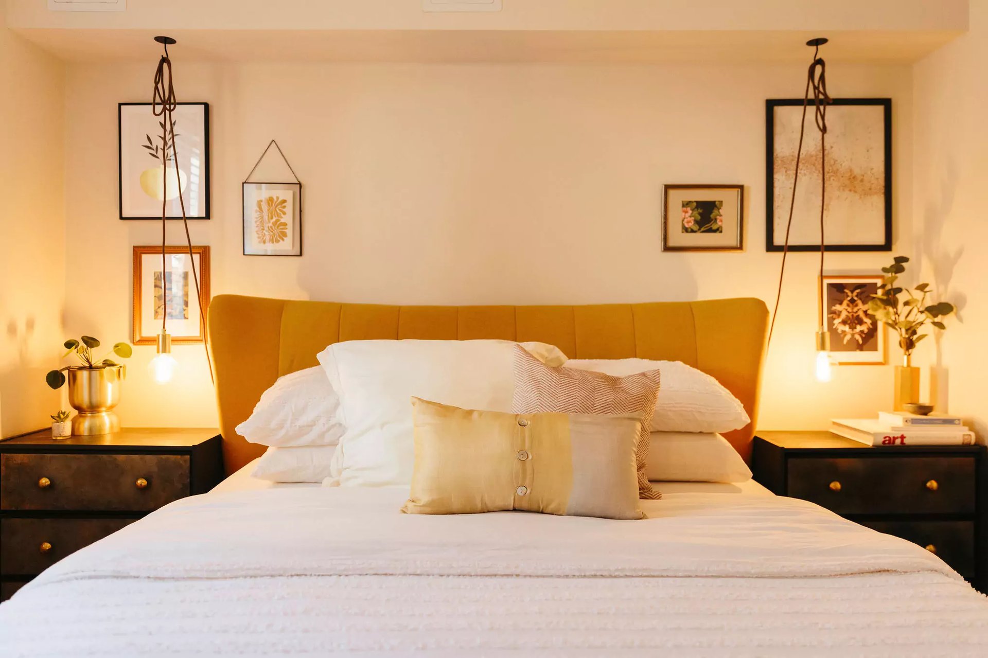 Warm neutral bedroom with yellow headboard