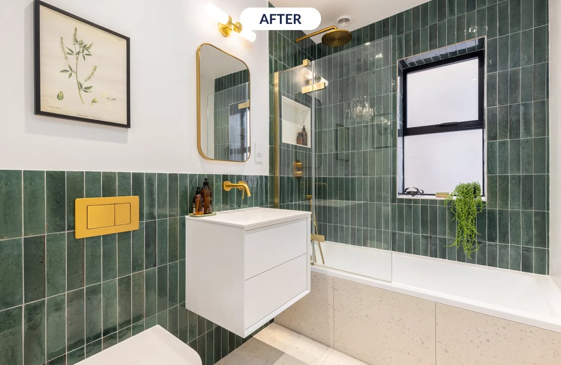 trendy bathroom with green tiles and gold finishes