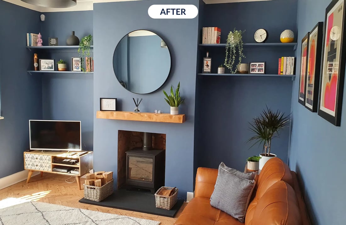 blue living room with fireplace and alcove shelving
