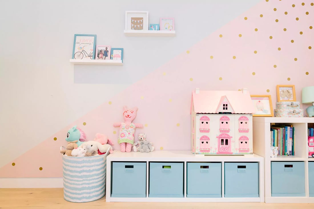 Pink and blue kids bedroom with feature wall