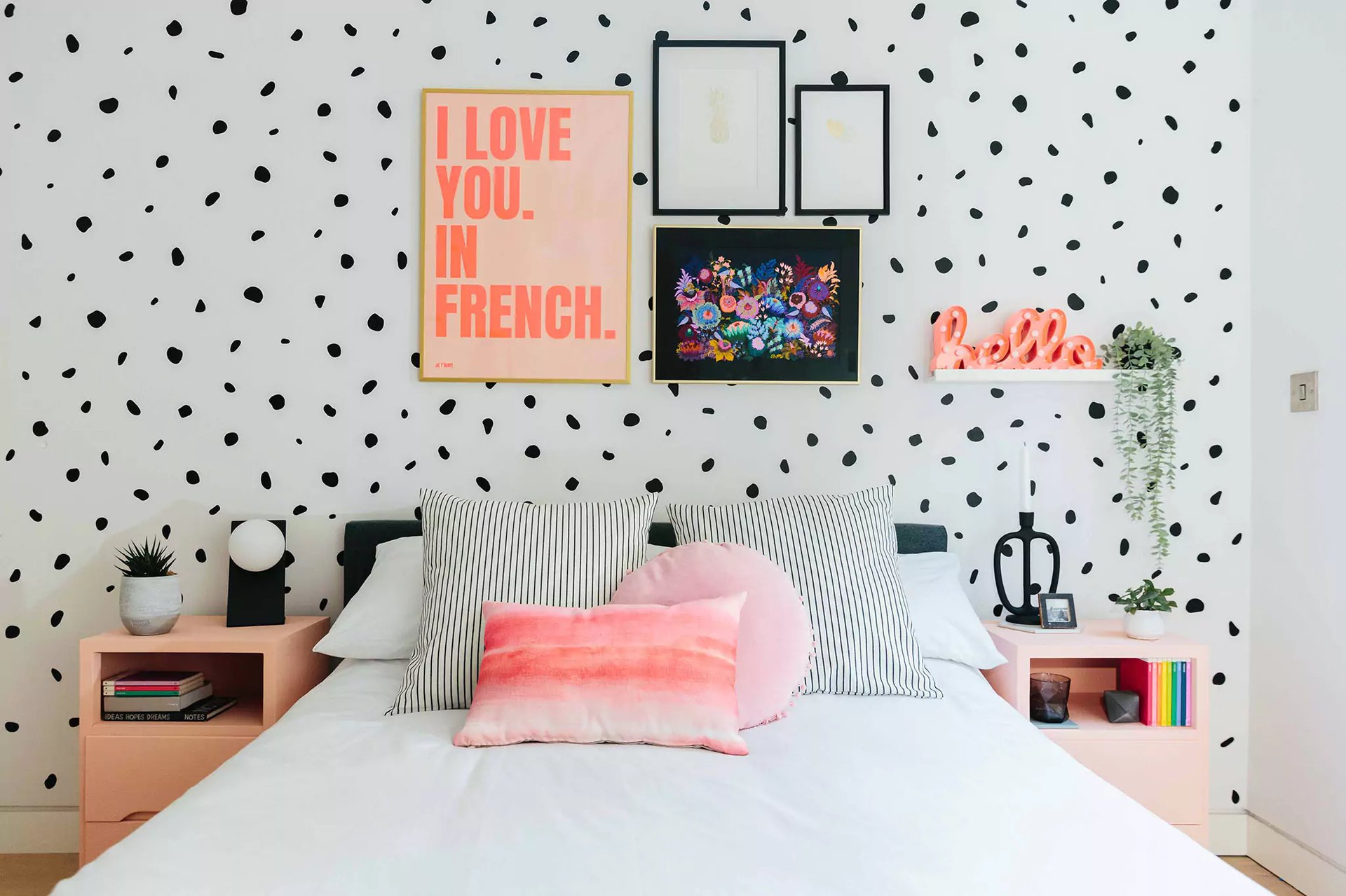 monochromatic kids bedroom with pink pops of colour 