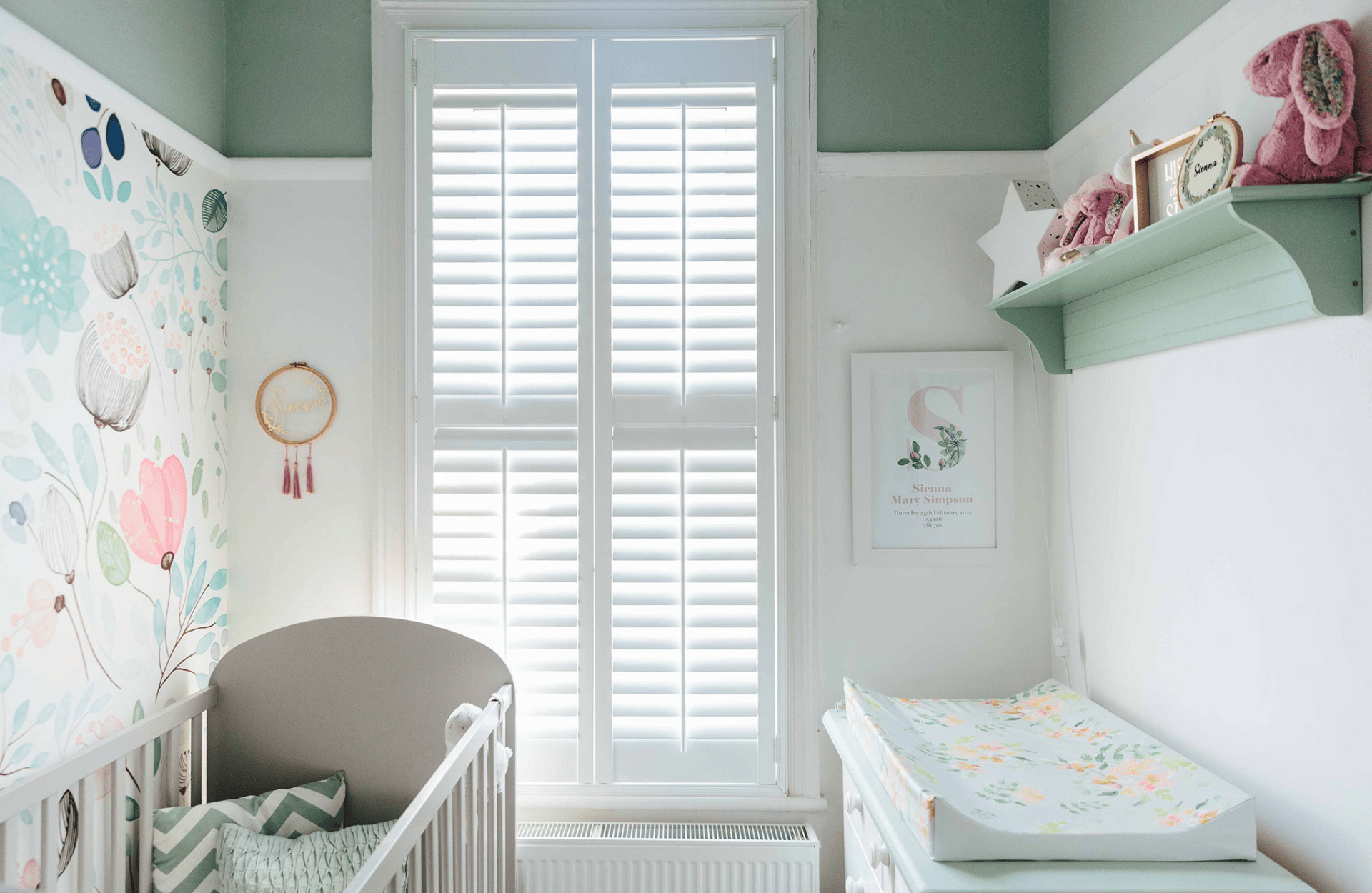 white and green nursery room