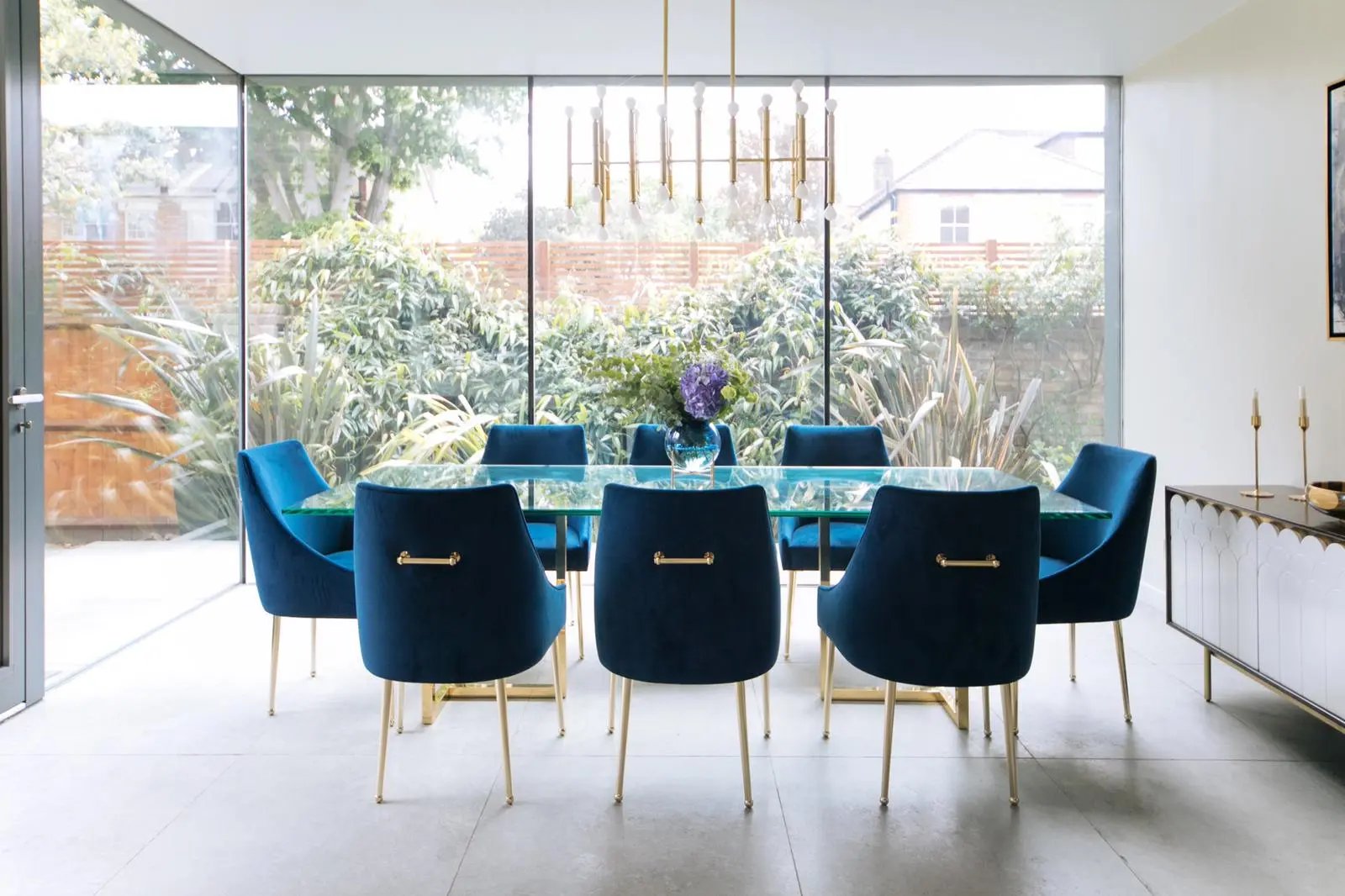 Blue dining room chairs in open plan space