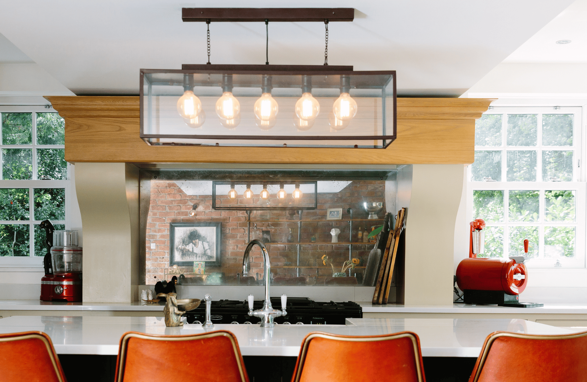eclectic kitchen with statement light