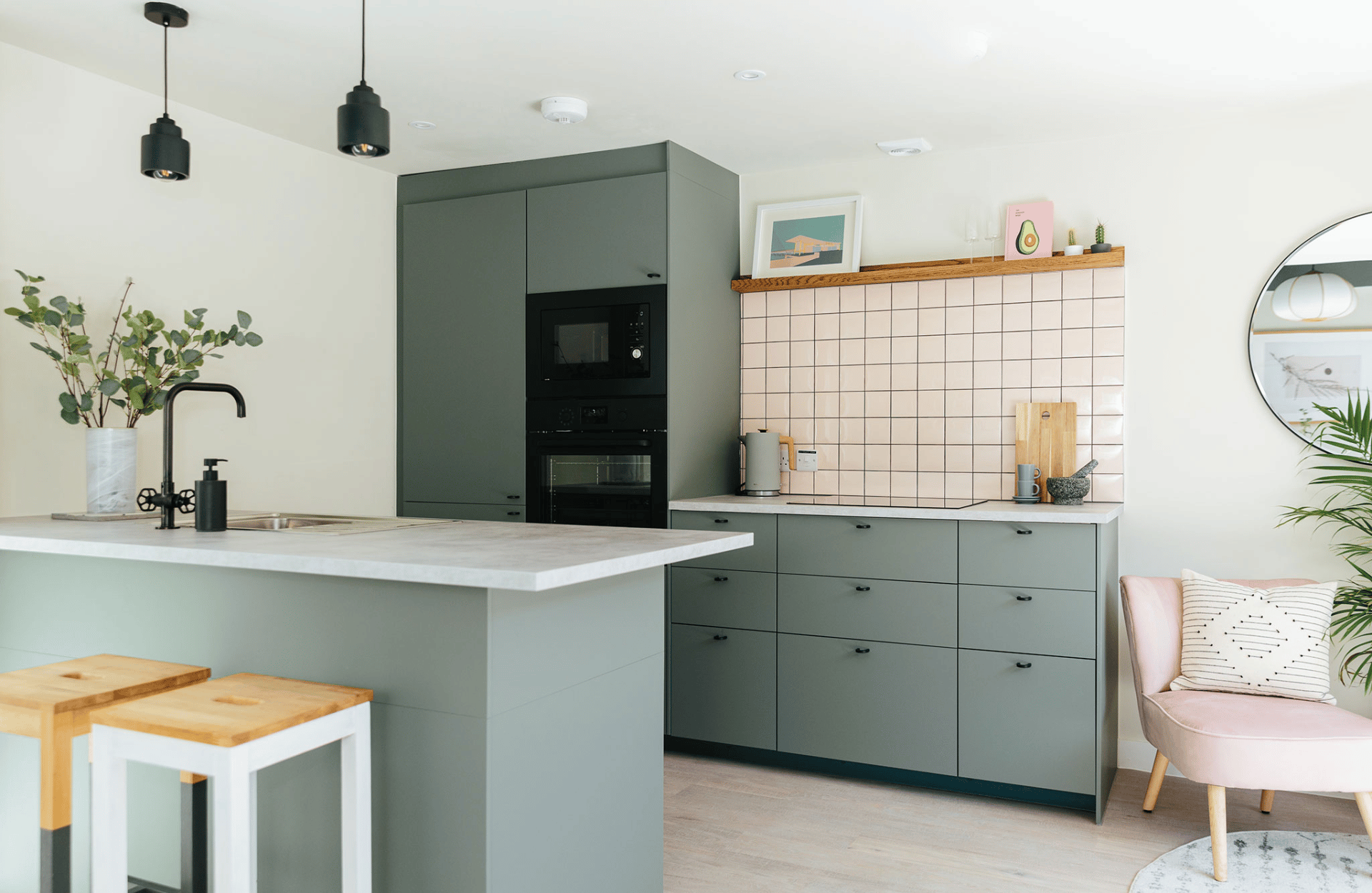 small grey kitchen with pink tiles