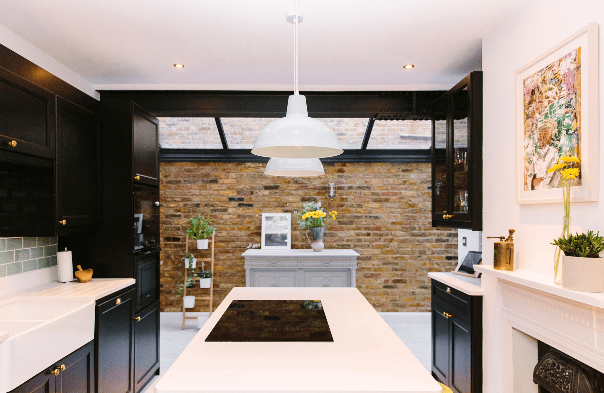 home extension with sky light and exposed brick wall