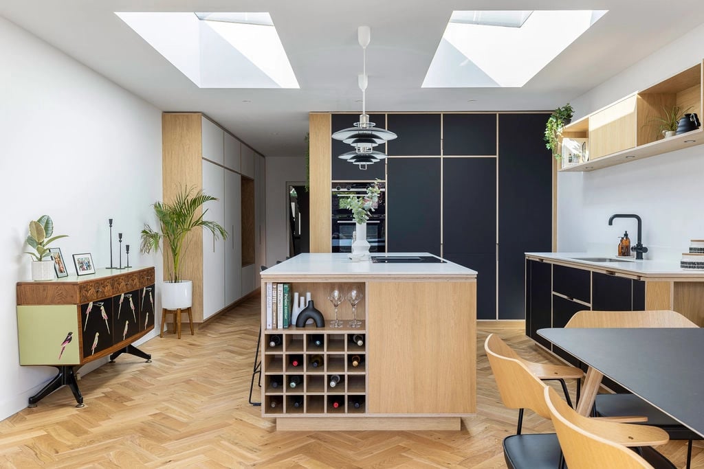 minimalistic contemporary kitchen with chevron flooring