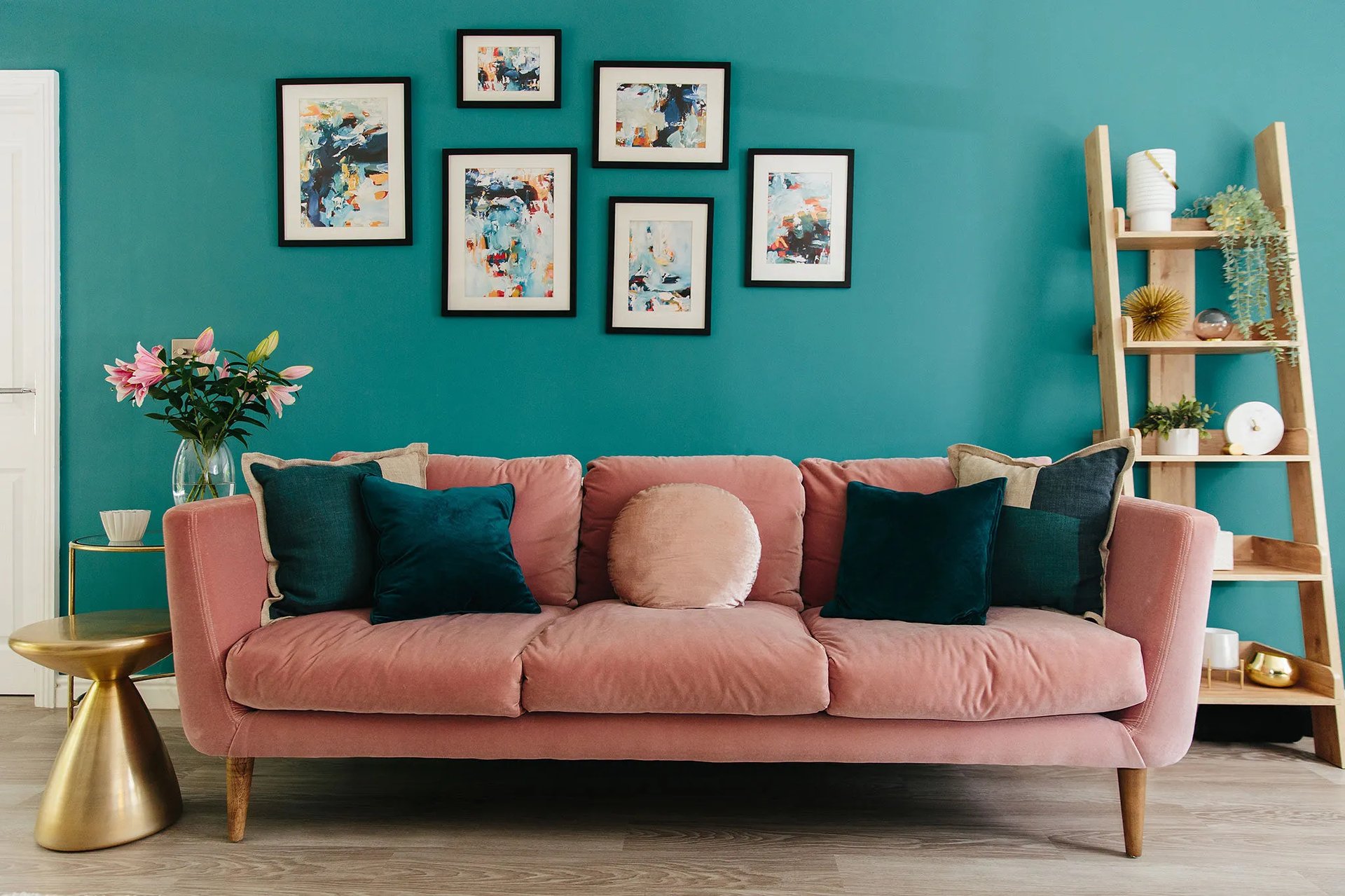 a bright pink and teal living room