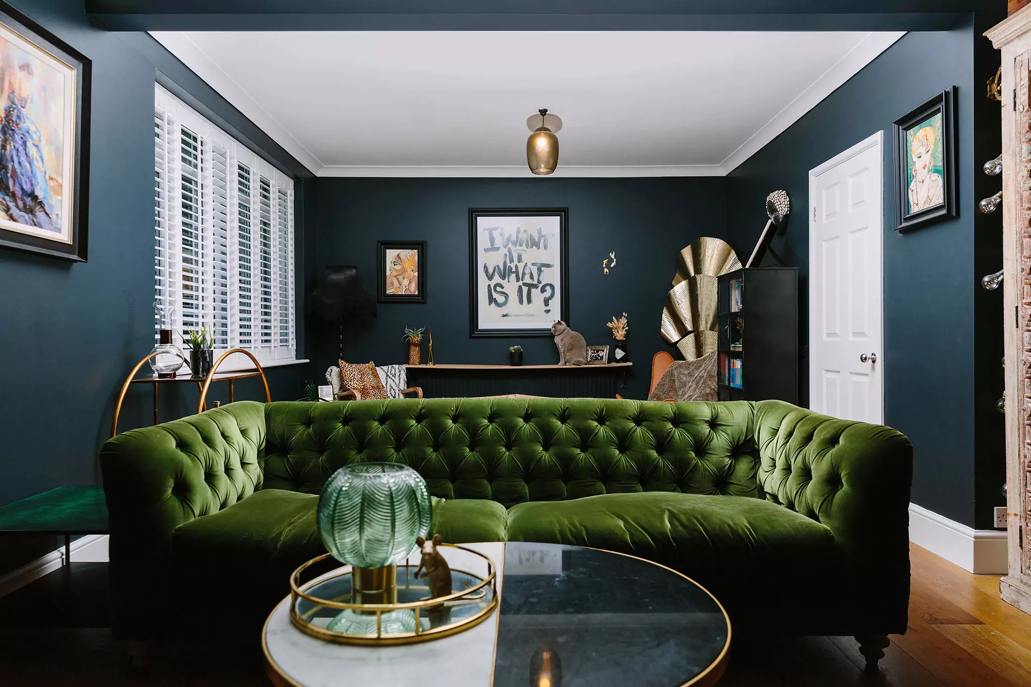 dramatic living room with green sofa