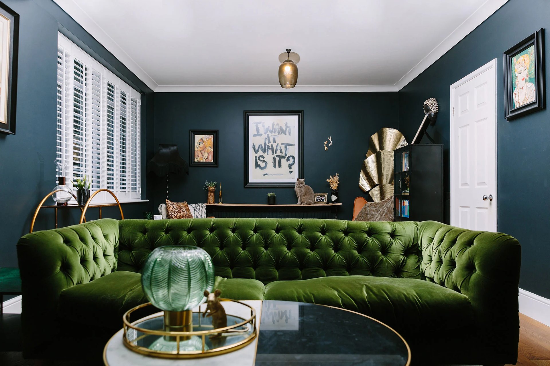 Velvet green sofa in industrial style living room