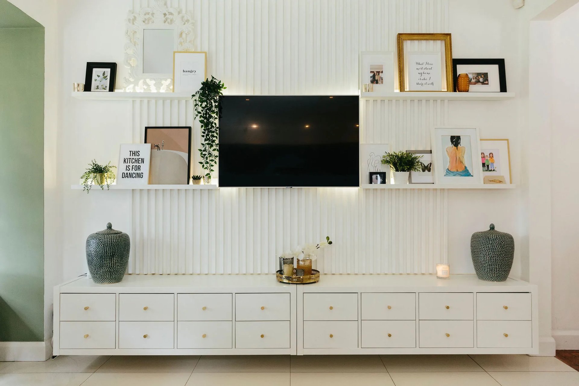 White wall with gallery picture ledge.