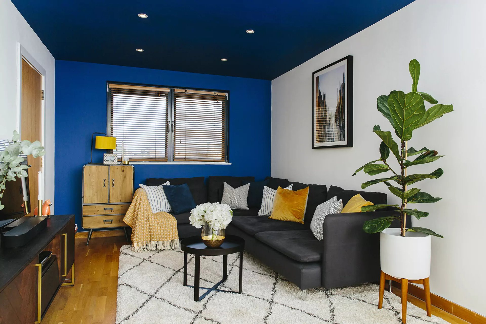 Living room with blue painted ceiling