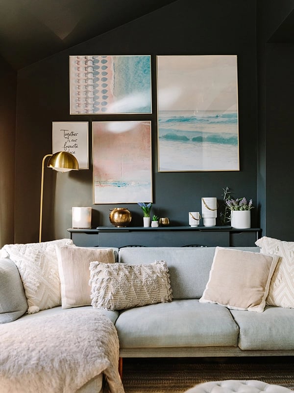 Dark grey living room with pastel gallery wall