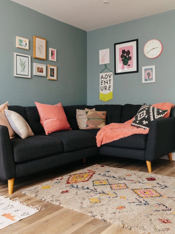 Eclectic gallery wall in pink and blue living room