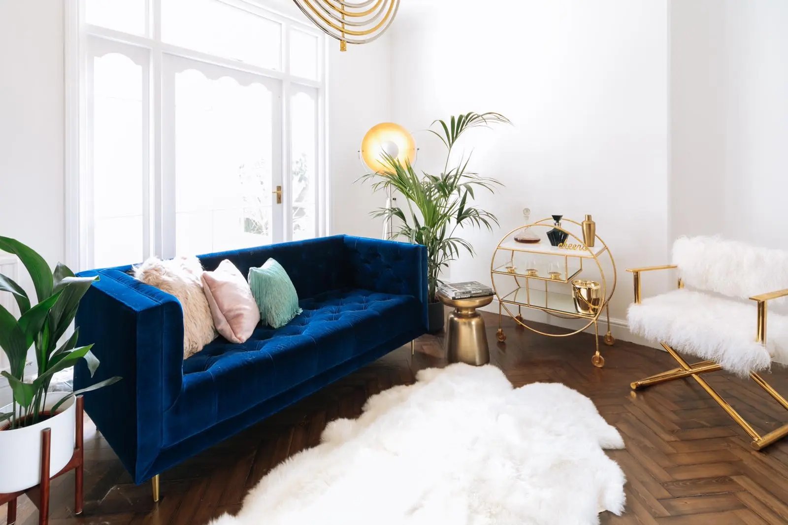 Bright white living room with blue and gold accents