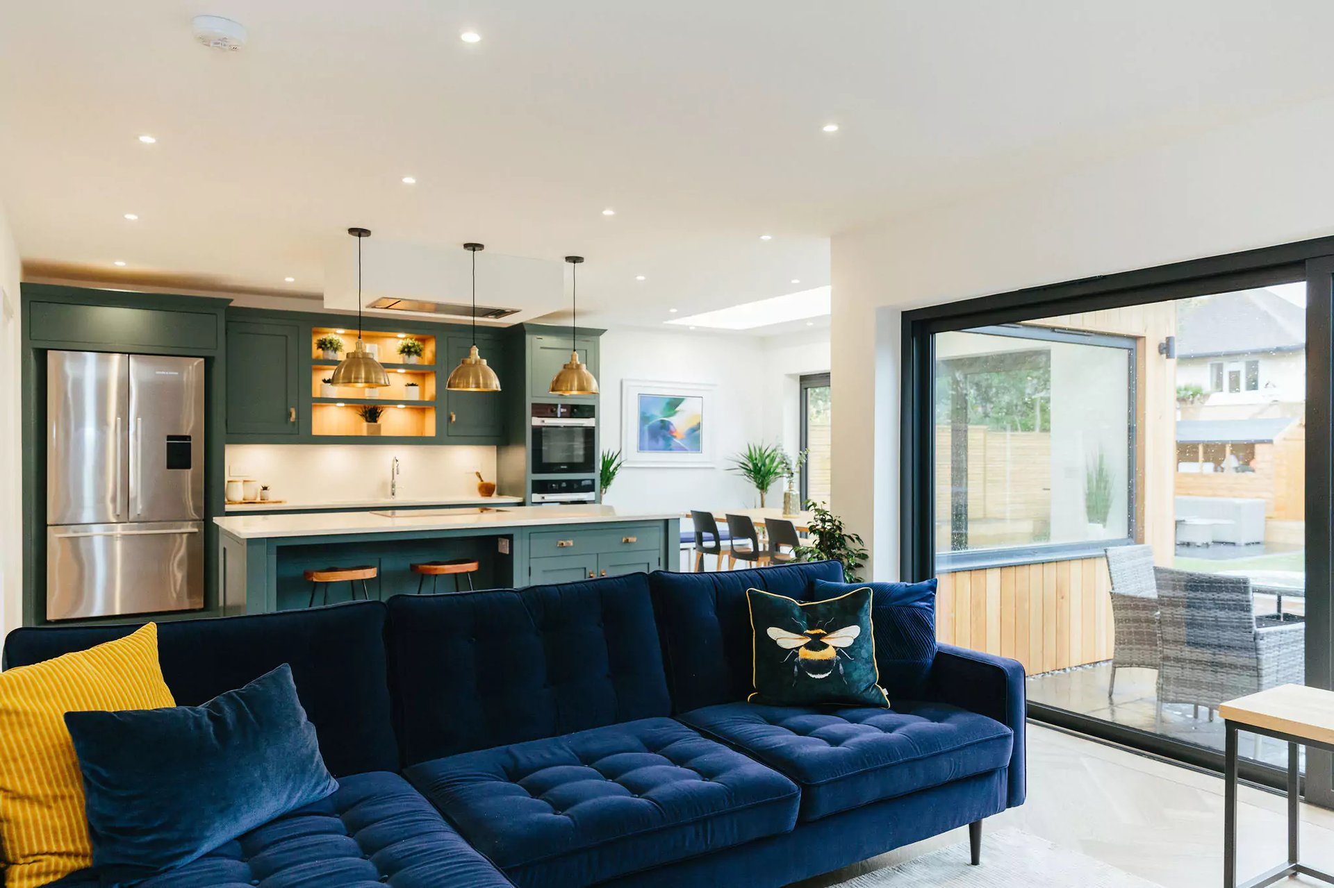 blue open plan living room and kitchen