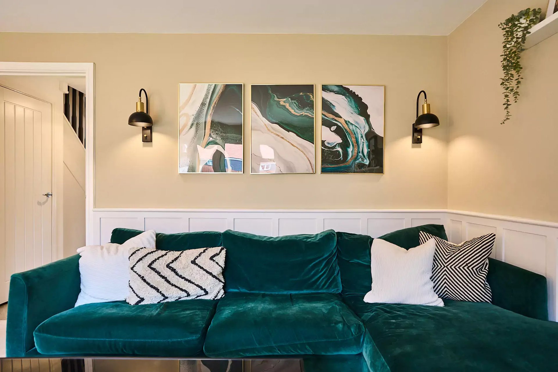Cosy living room with emerald accents