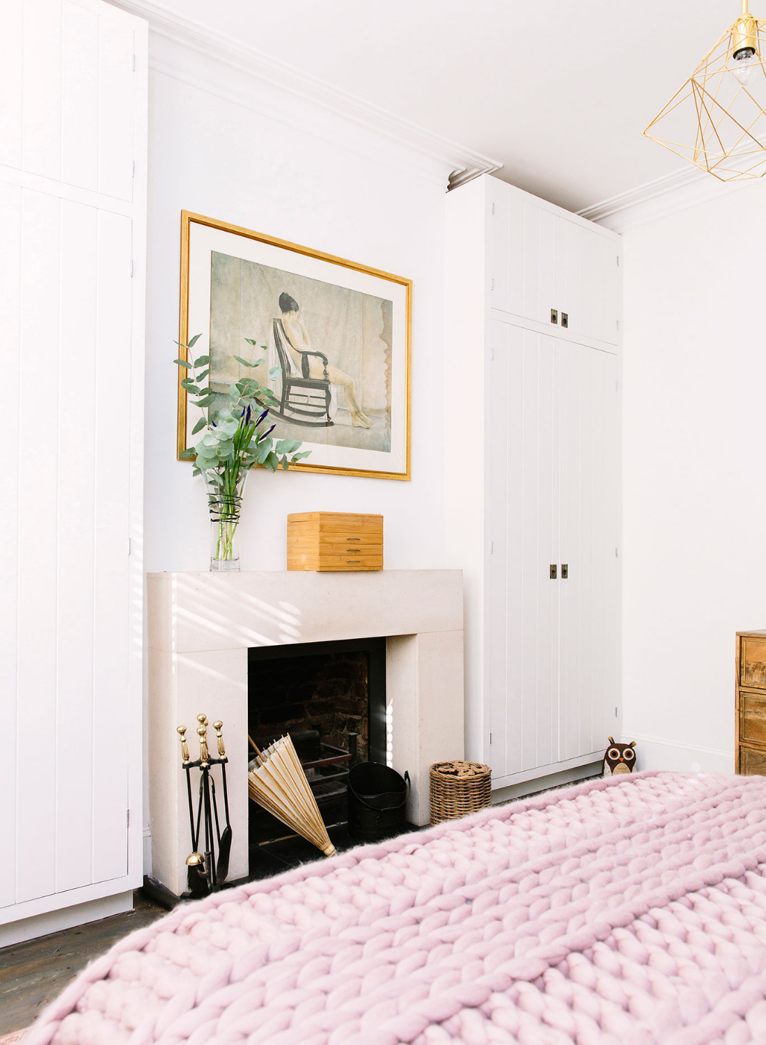 blush bedroom with bespoke built in wardrobes and chunky throw 